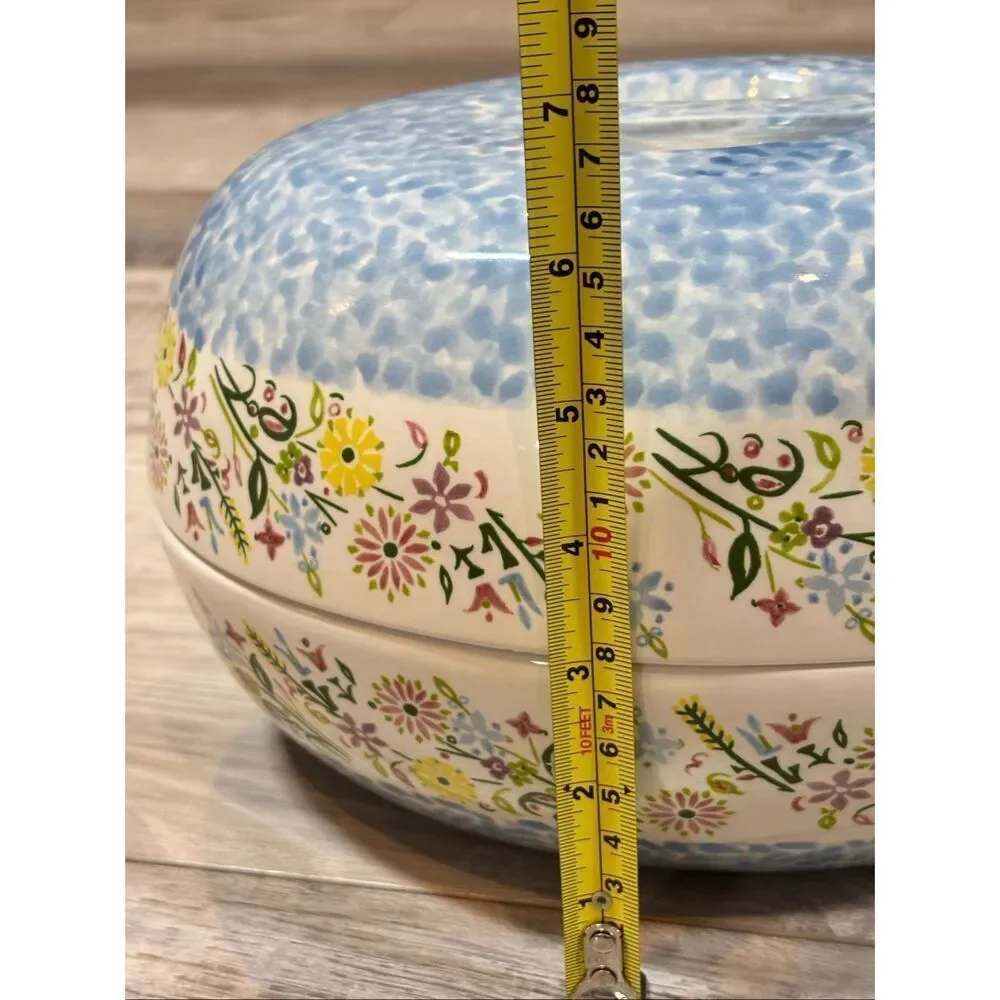 Temp-tations Ovenware by Tara Blue oval covered casserole dish with a metal stan